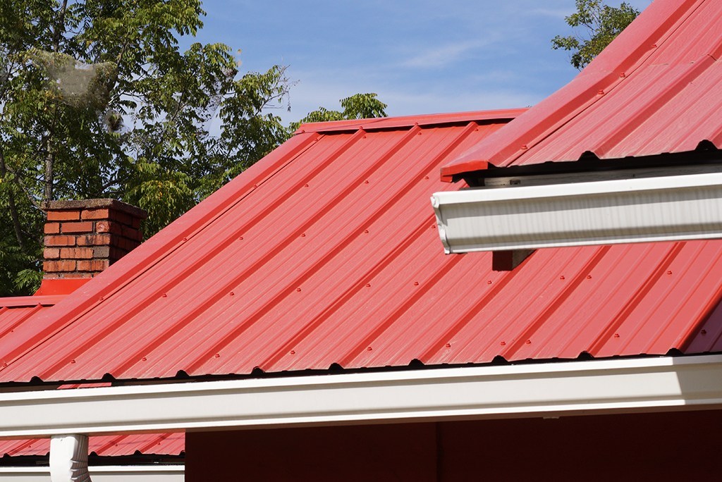 About Pitched Roofs With Metal Roofing? red metal roof 1 - About Pitched Roofs With Metal Roofing?