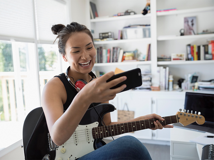 Female Phone Guitar 732x549 thumbnail - What Makes A Long-Distance Relationship Work?